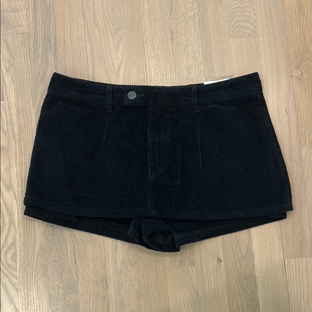 Free People Gallivanting Peekaboo Low Rise Mini Skort — Black Corduroy
